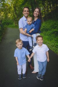 Dr Kate Huza and Family Outside Smiling